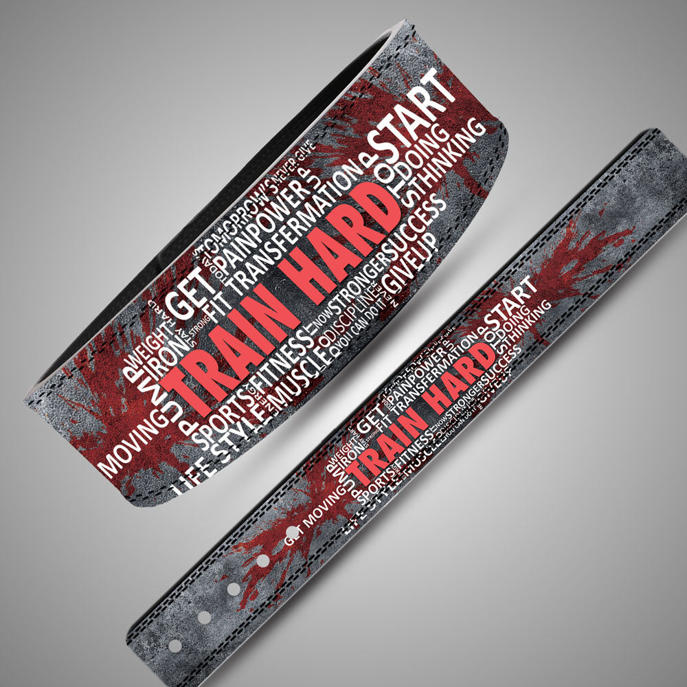Panoramic layout of weightlifting belt strap showing Train Hard word-cloud artwork and concrete texture