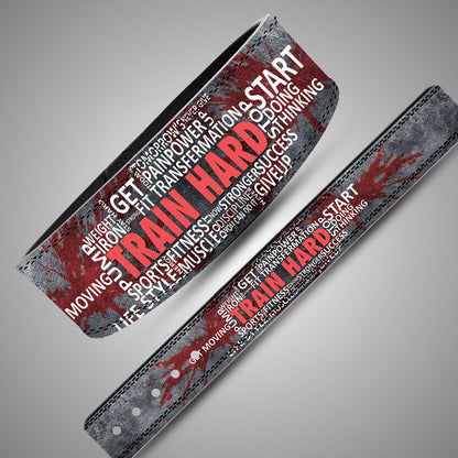 Panoramic layout of weightlifting belt strap showing Train Hard word-cloud artwork and concrete texture