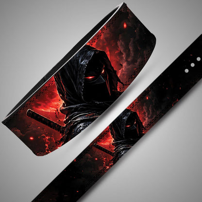 Angled close-up and flat strap view of a masked ninja lifting belt with red eyes, a sword handle and red smoke