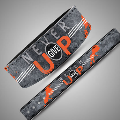 Panoramic view of Never Give Up weightlifting belt strap showing industrial concrete background and orange text