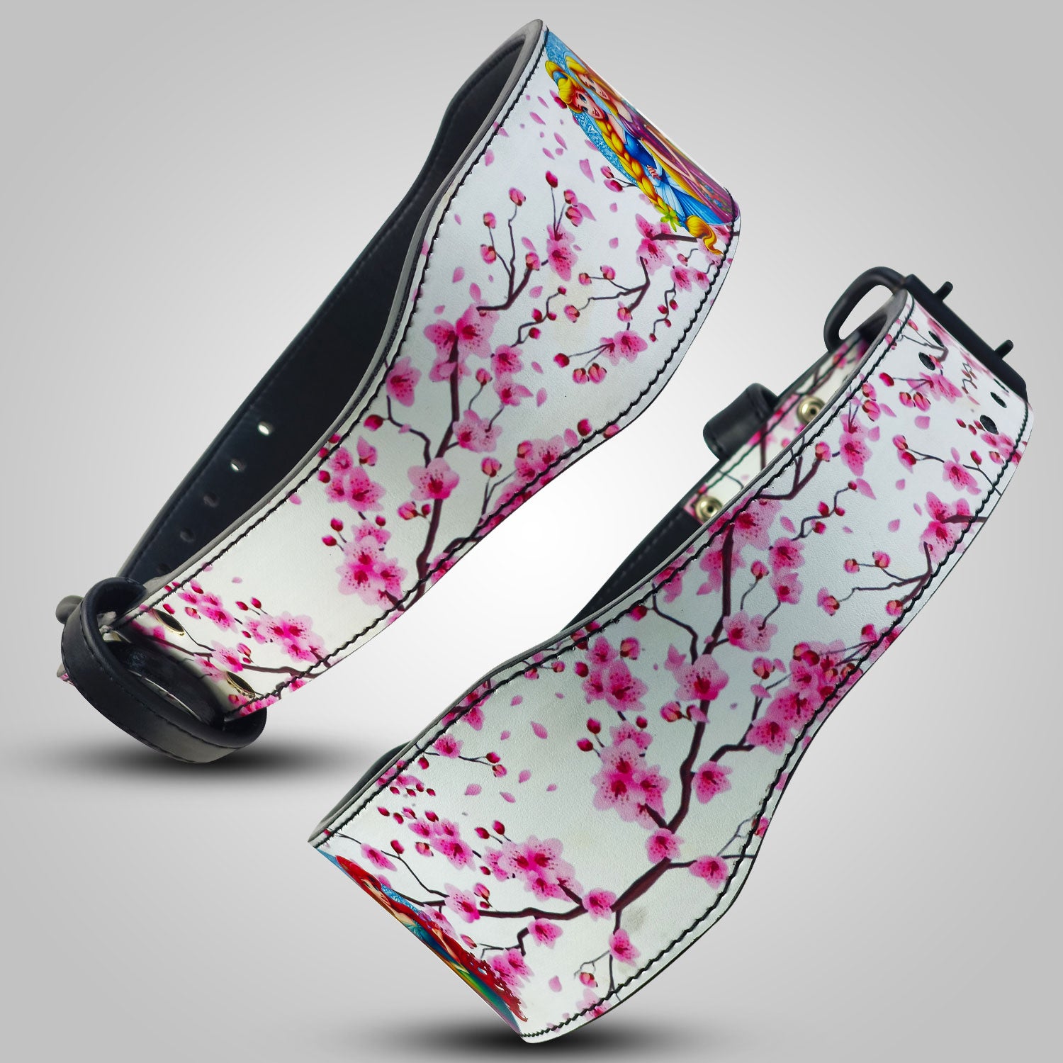 Two Weightlifting Belts with cherry blossom design on a gray background